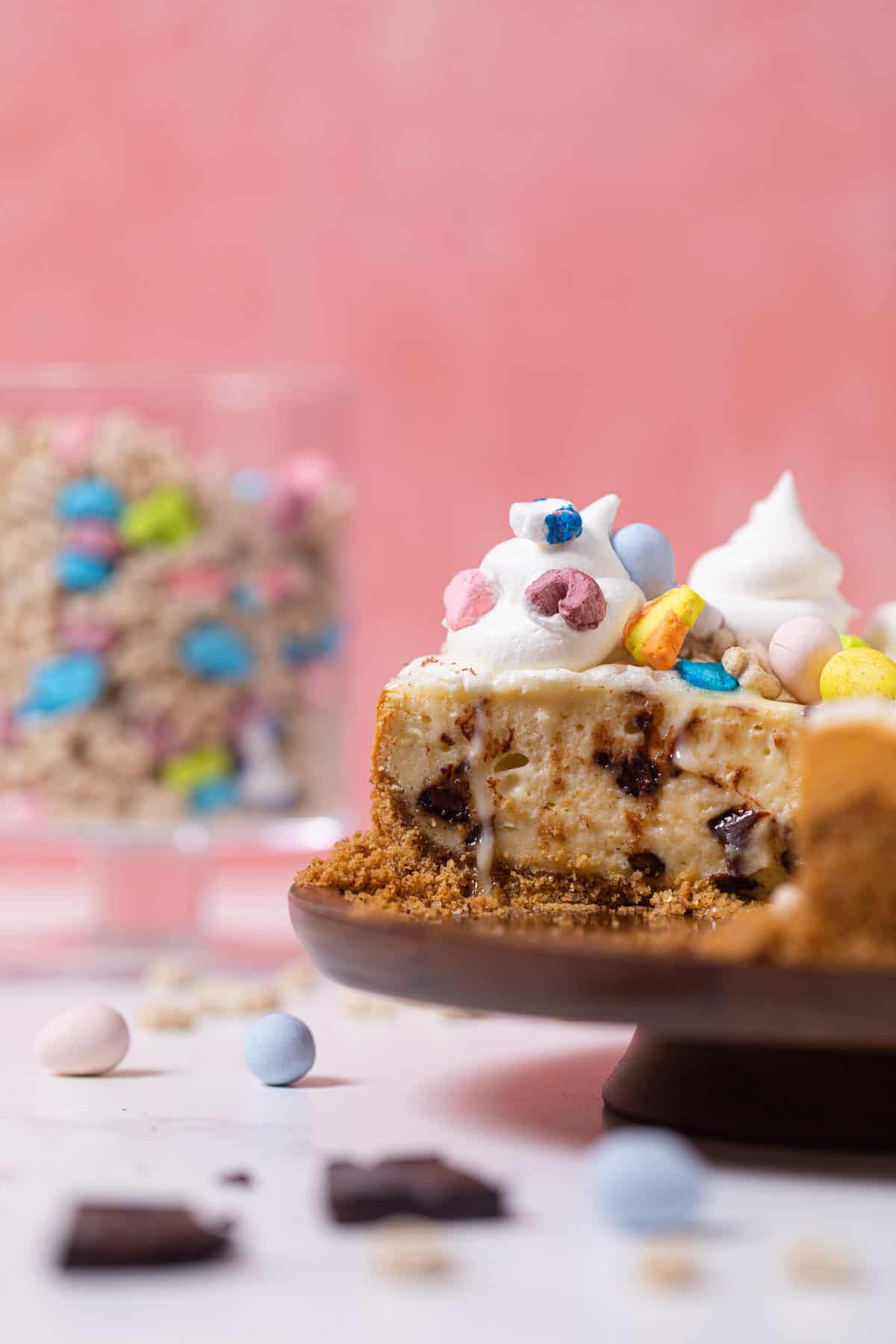 Chocolate Chip Lucky Charms Cheesecake missing a slice.
