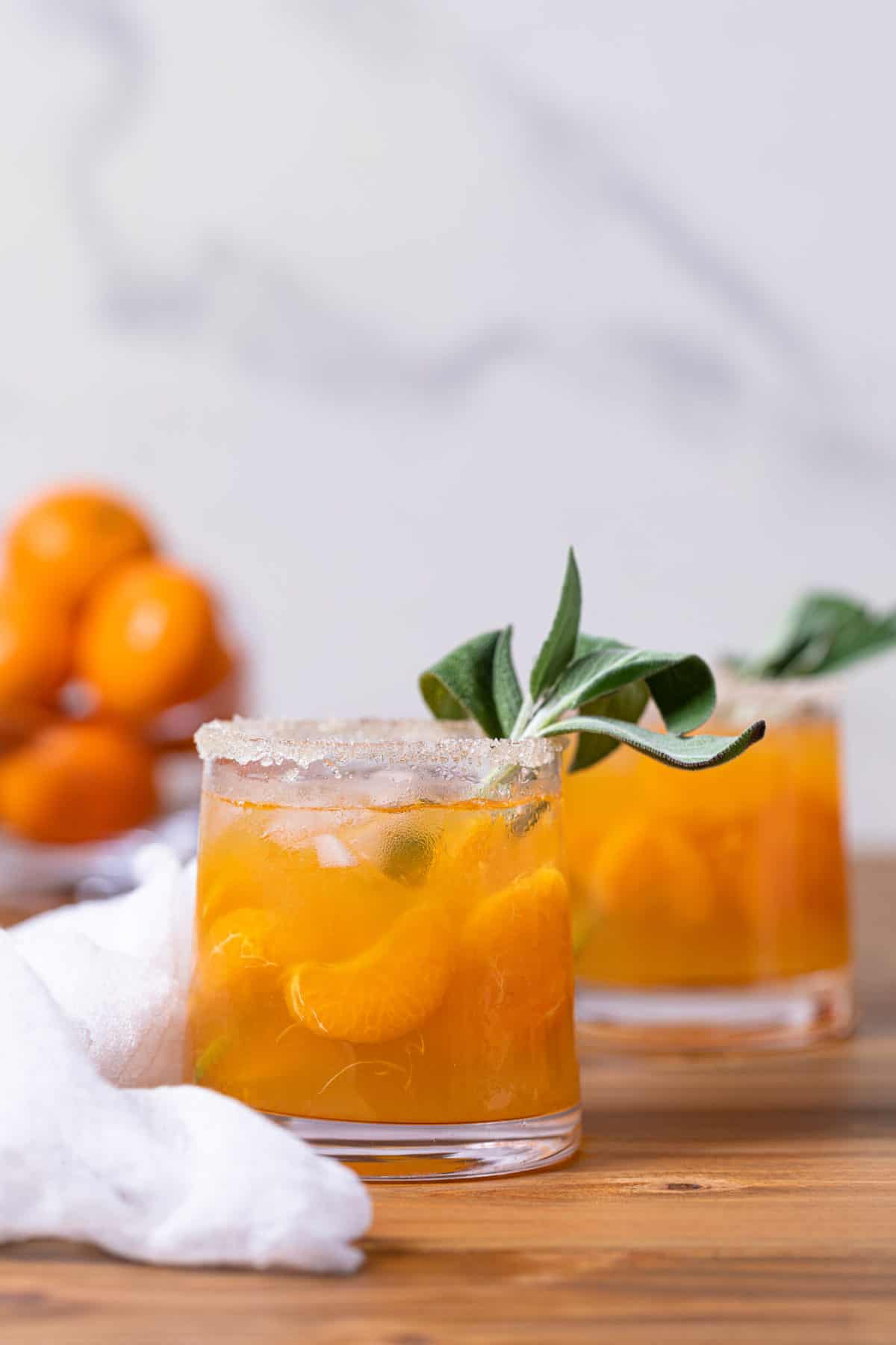 Citrus Honey Sage Drink in two small glasses.