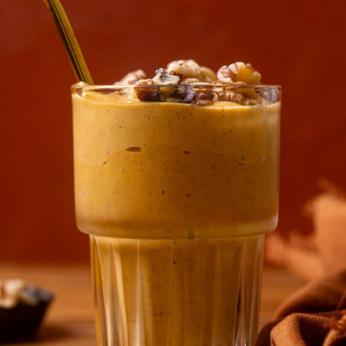 Up close shot of Cozy Sweet Potato Pie Smoothie with a straw.