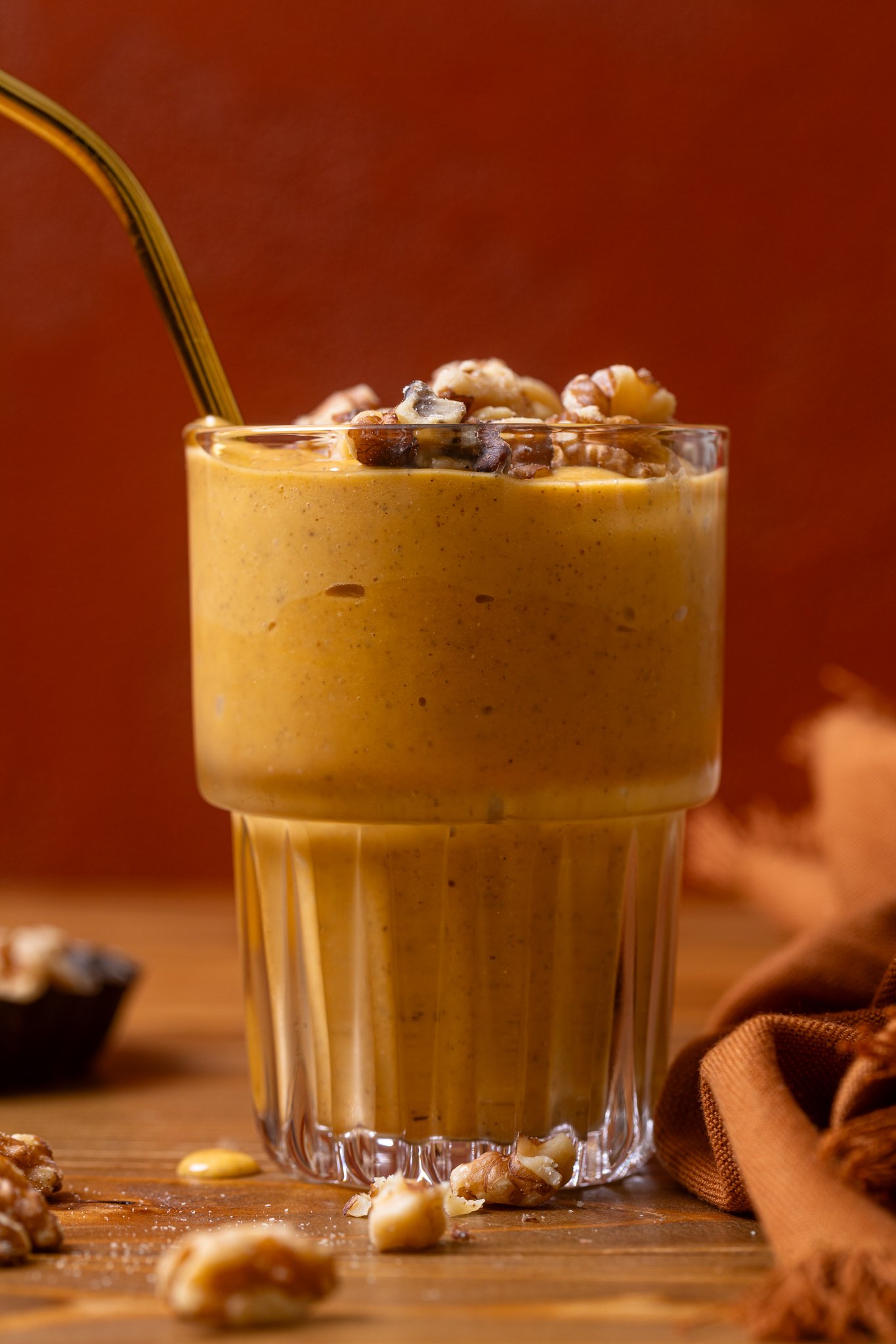 Up close shot of Cozy Sweet Potato Pie Smoothie with a straw.