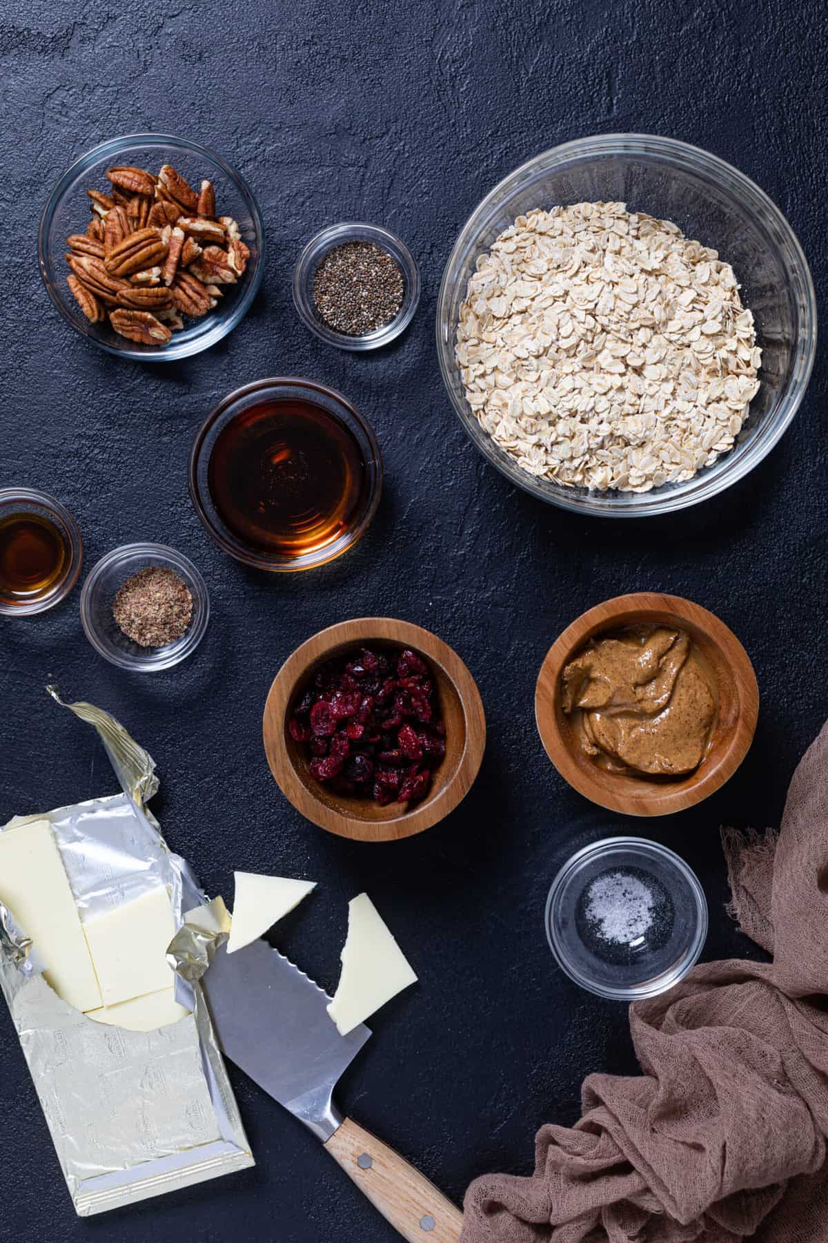 Overhead shot of the ingredients for White Chocolate Cranberry Energy Bites in small bowls.