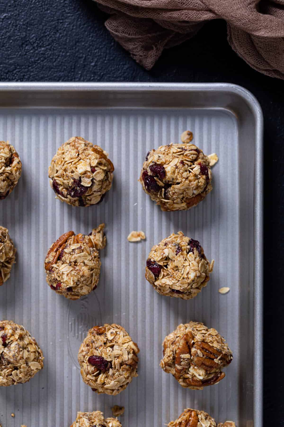 Overhead shot of White Chocolate Cranberry Energy Bites on a baking sheet.