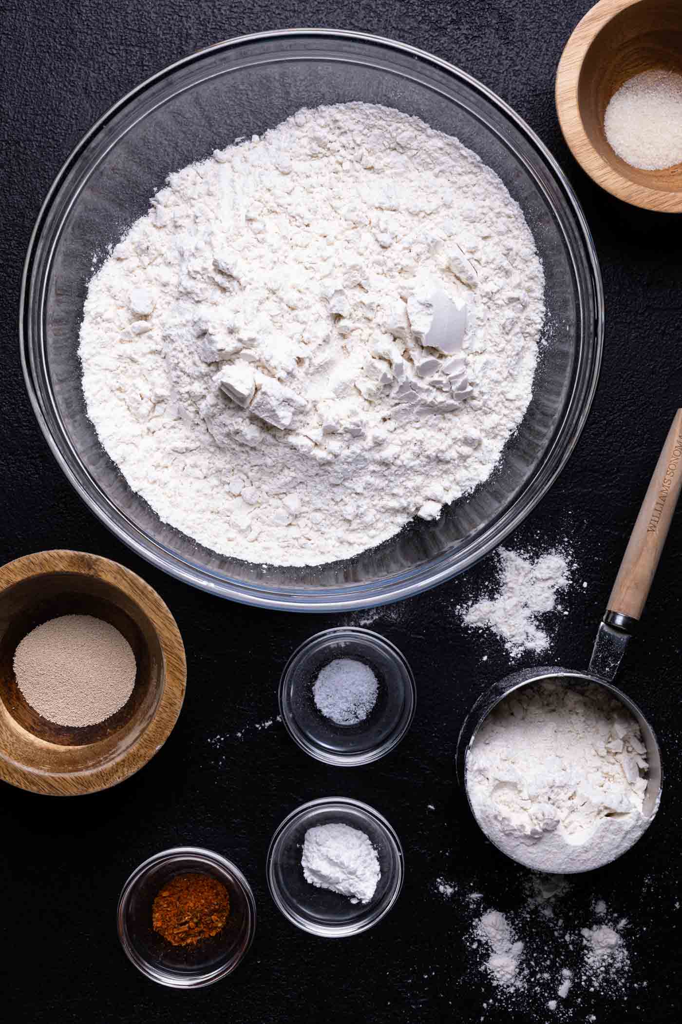 Ingredients for gluten free pizza crust in small bowls.