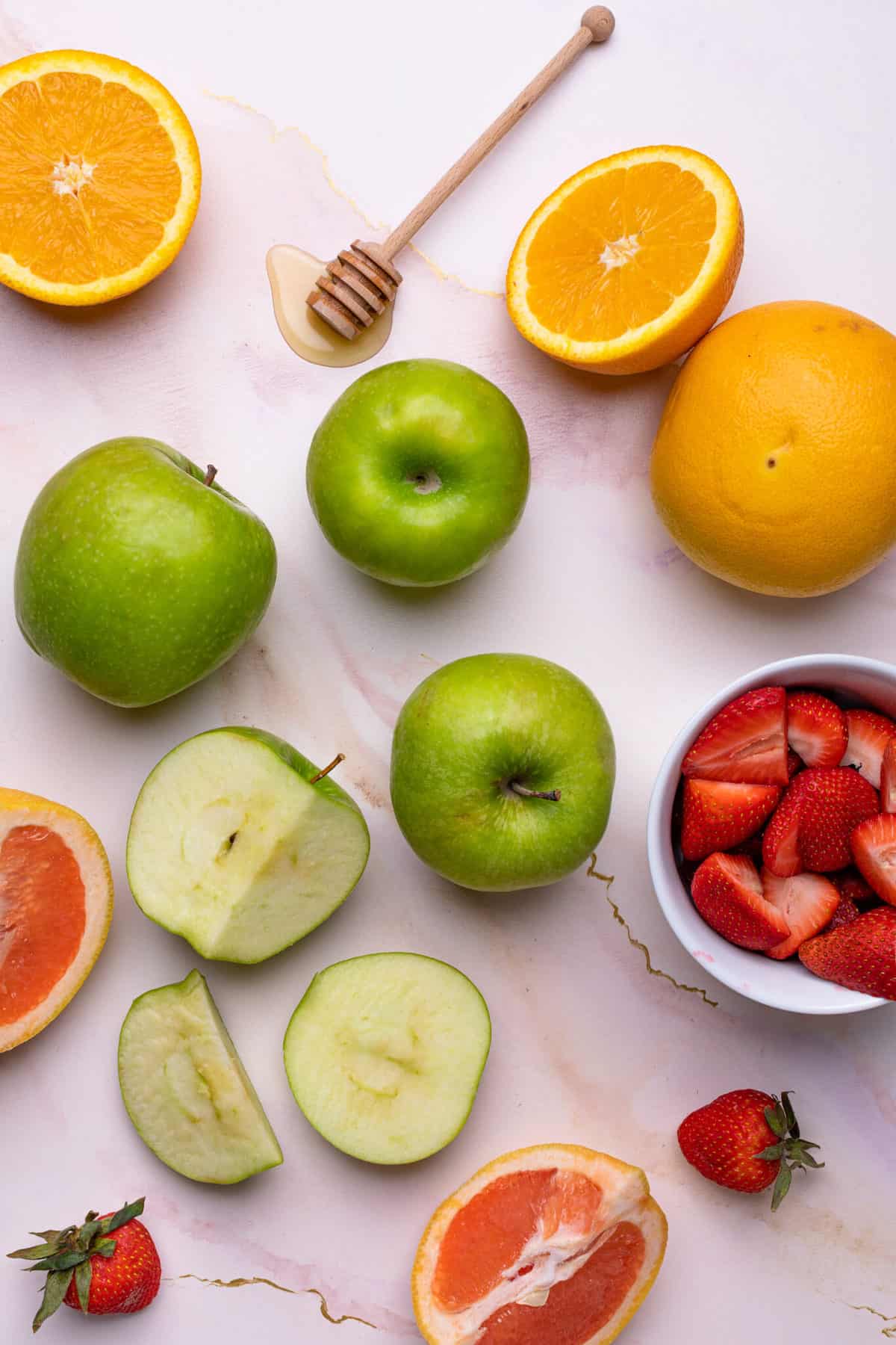 Overhead shot of fresh apples, strawberries and citrus.