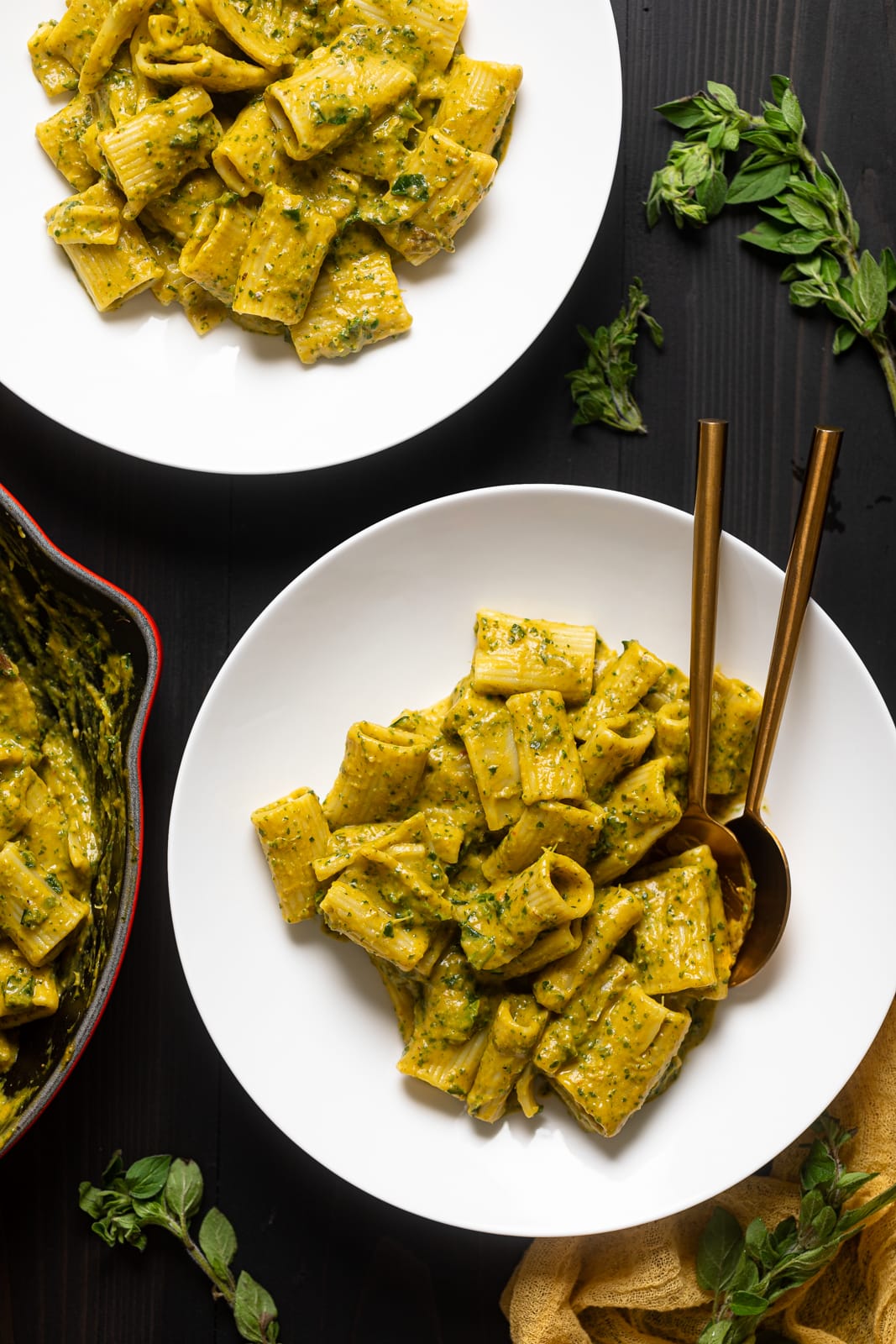 White plates of Creamy Vegan Sweet Potato Pasta.