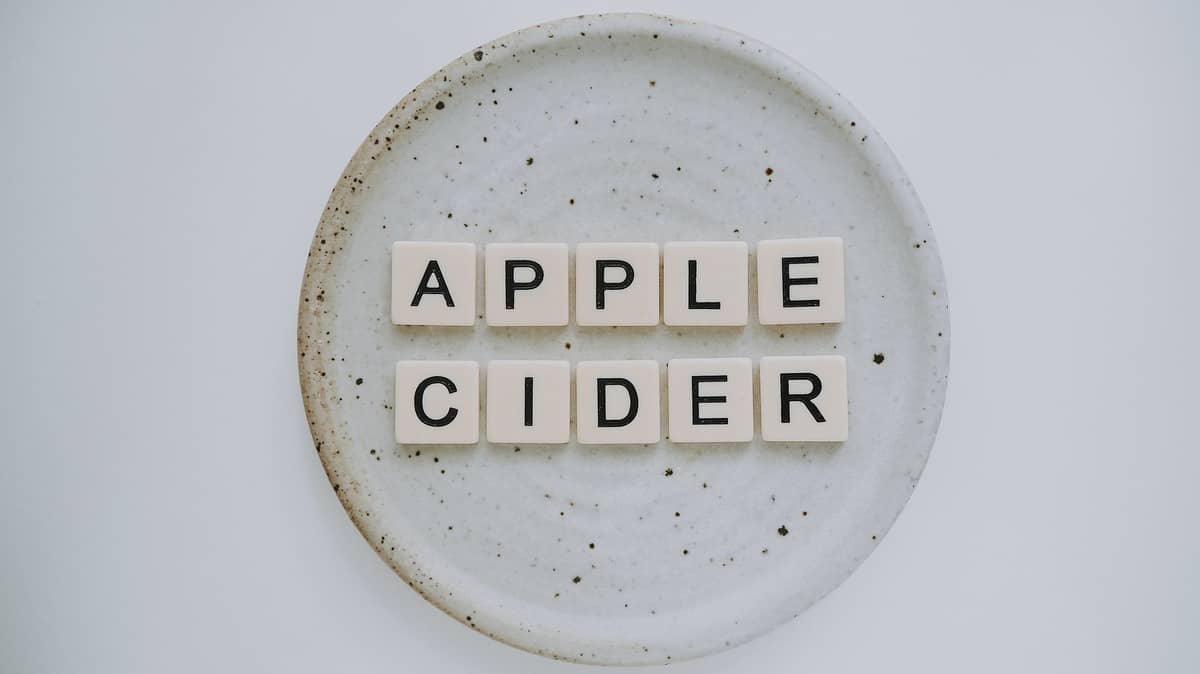 Plate with Scrabble letters that spell \"Apple Cider.\"