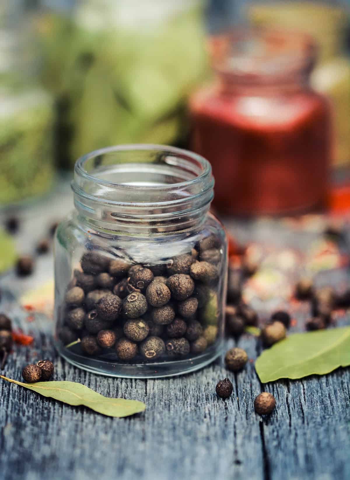 Small jar of peppercorns.