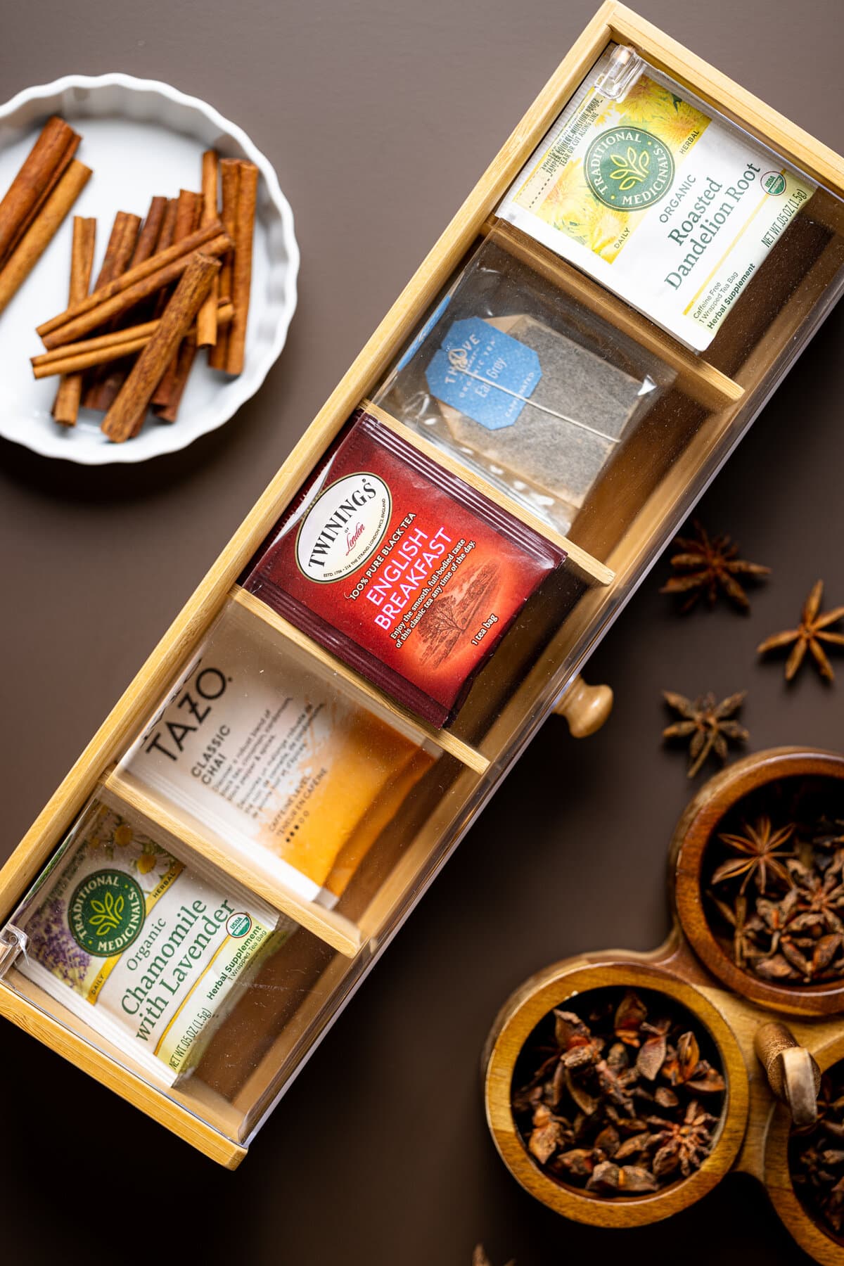 Drawer with various bags of tea next to spices