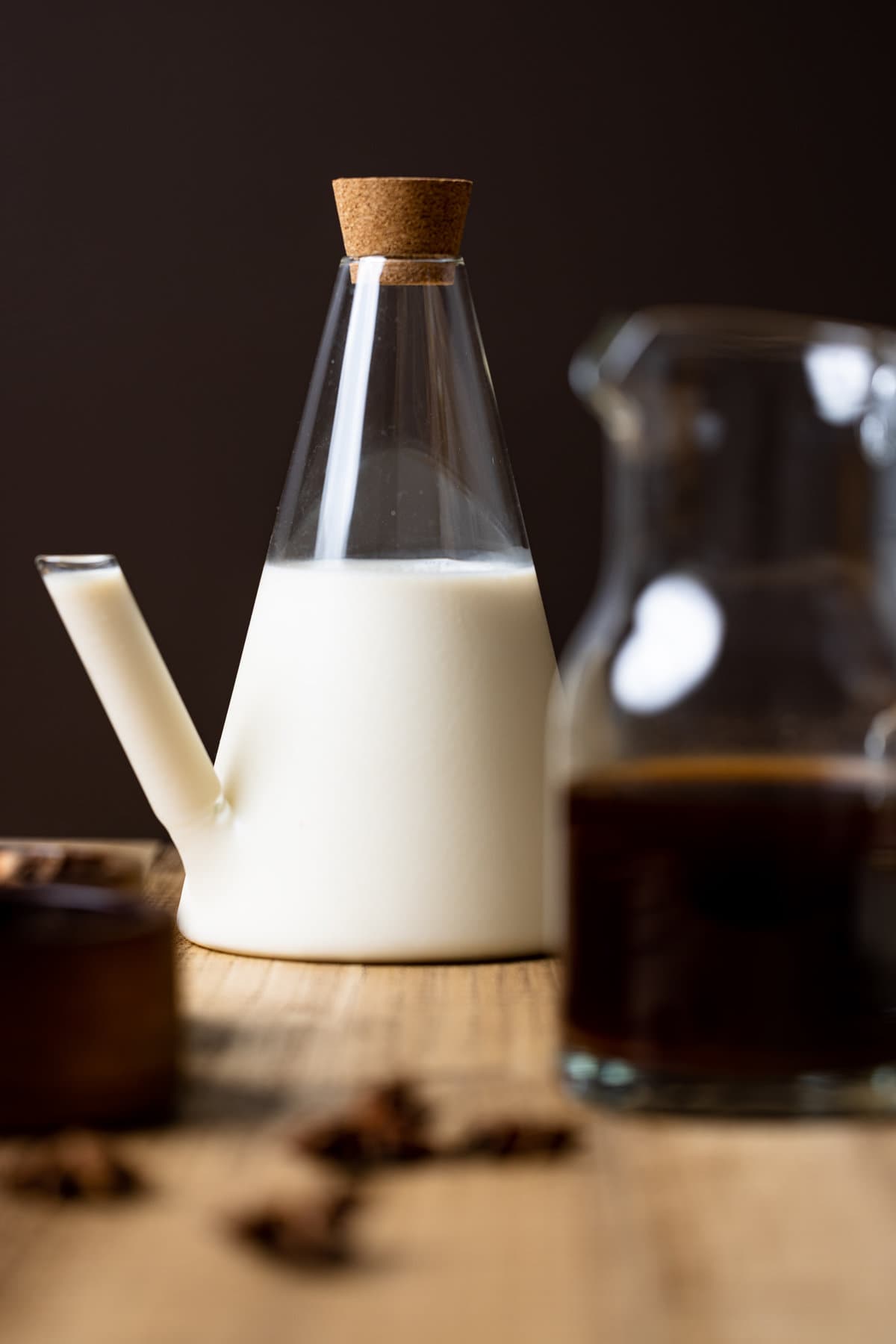 Glass containers of coffee and plant-based milk