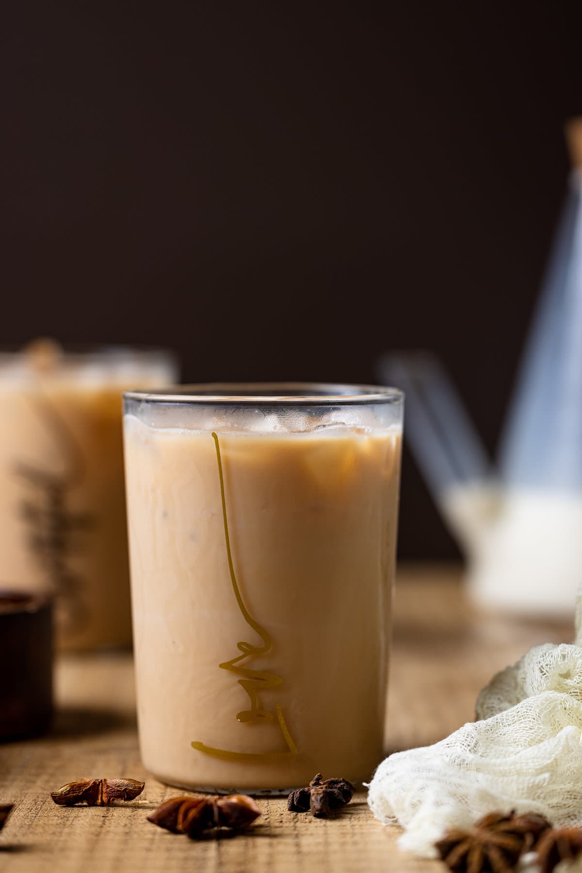 Iced Chai Tea Latte in a glass that reads \"love\"