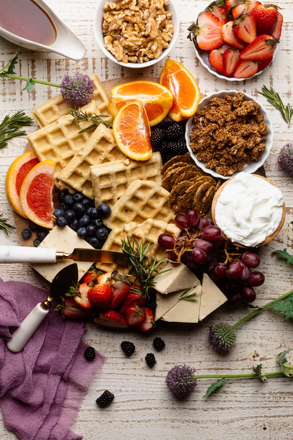 Vegan Brunch Charcuterie Board with colorful fruit, chunks of vegan cheese, and more.