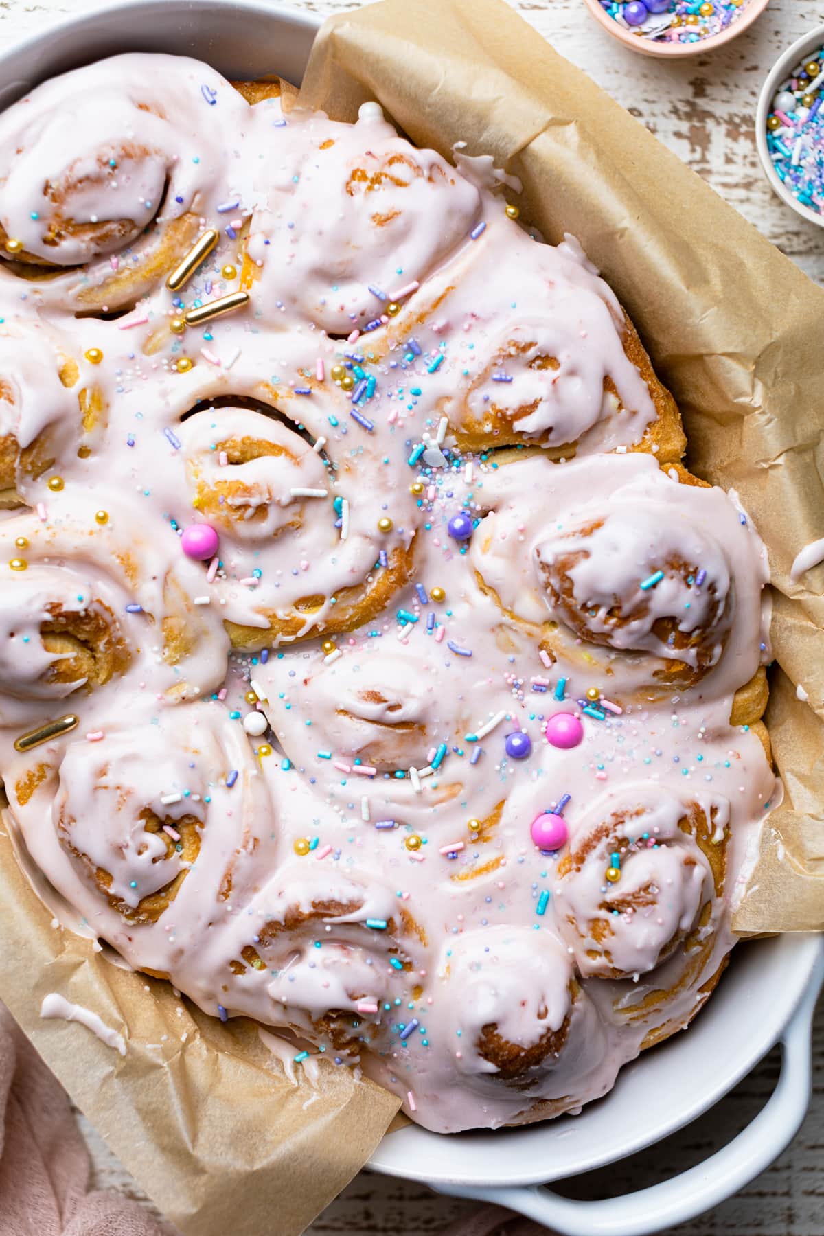 Vegan Funfetti Cinnamon Rolls topped with sprinkles.