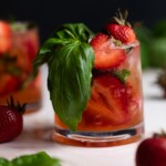 Strawberry Basil Pineapple Mocktail in a small glass.