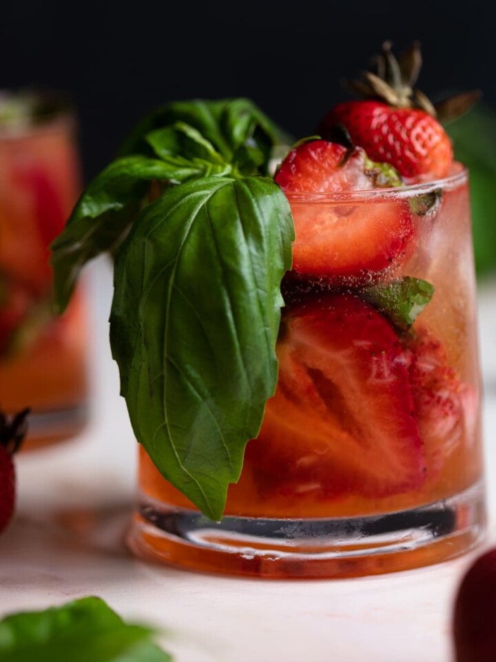 Strawberry Basil Pineapple Mocktail in a small glass.