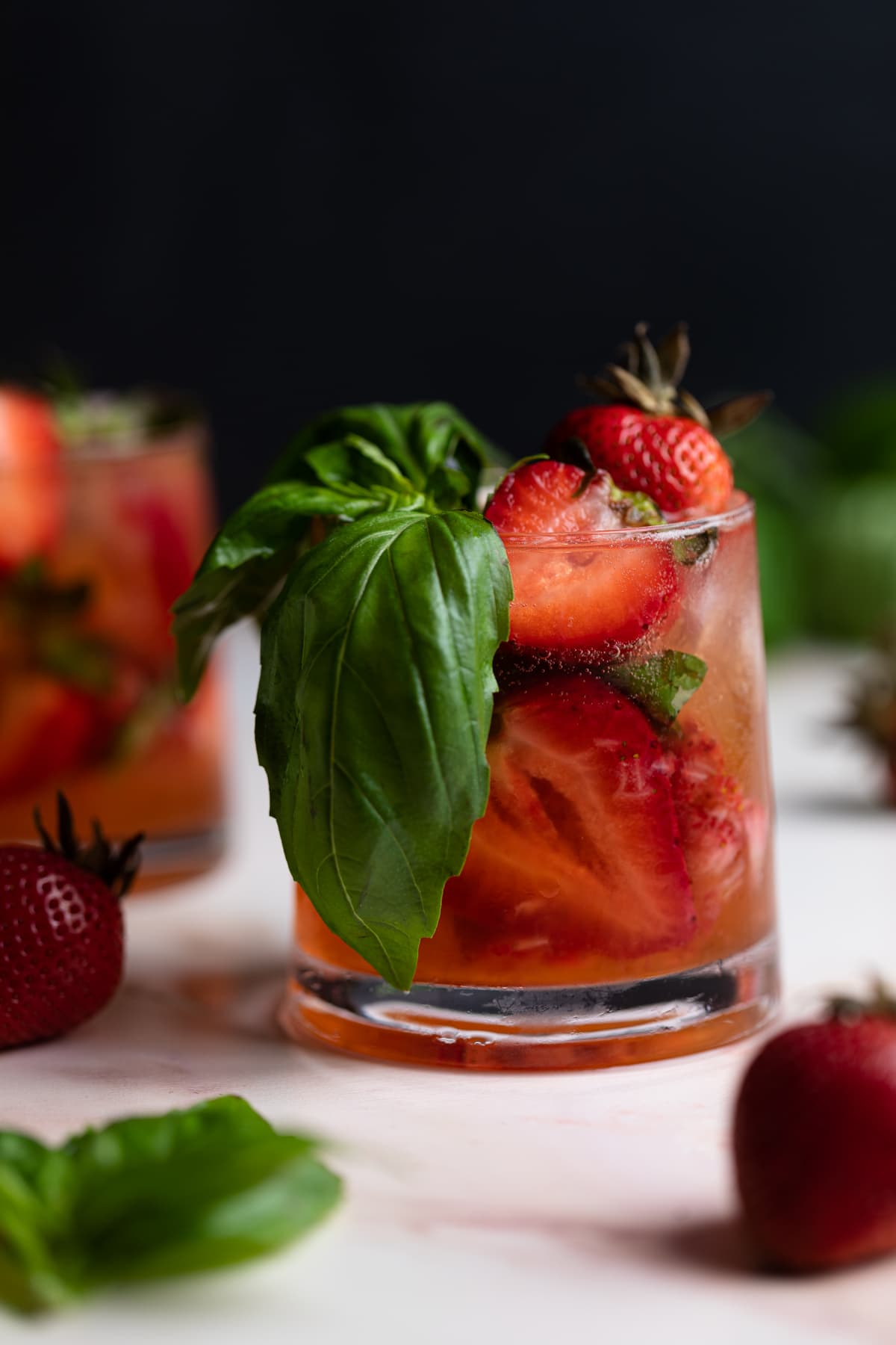 Strawberry Basil Pineapple Mocktail in a small glass.