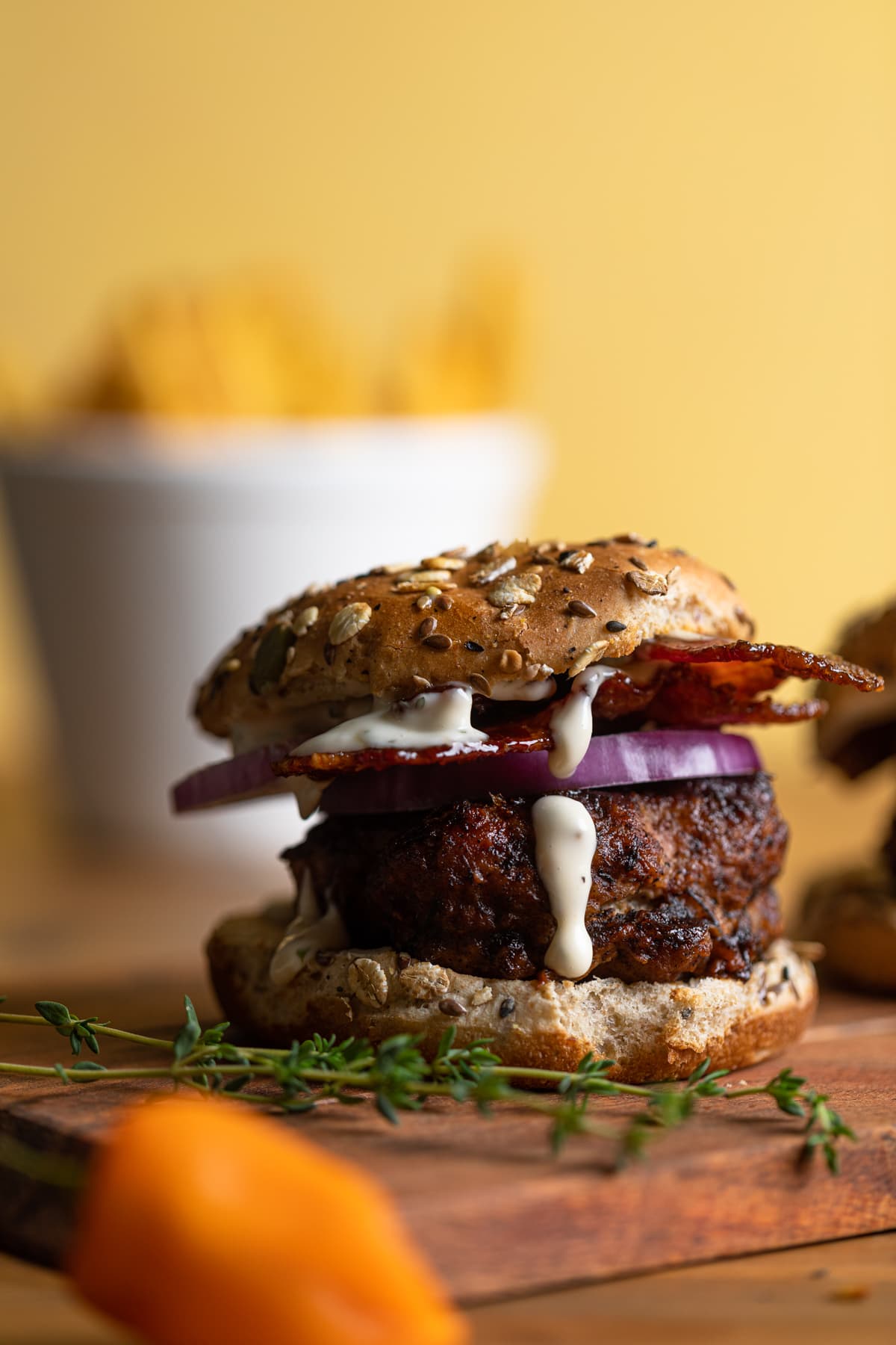 Barbeque Jerk Bacon Turkey Burger on a wooden board.