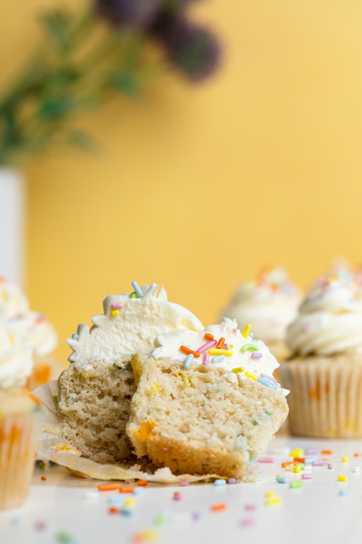 Vegan Funfetti Cupcake cut in half.