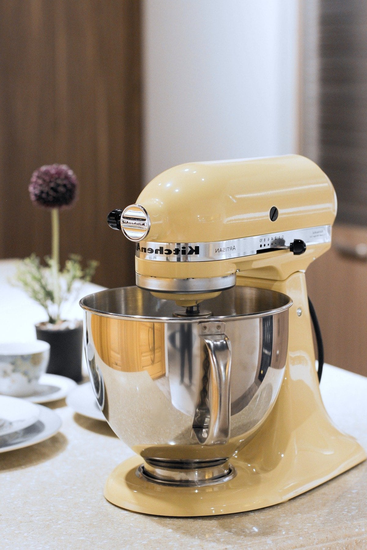 Light yellow Kitchenaid stand mixer.