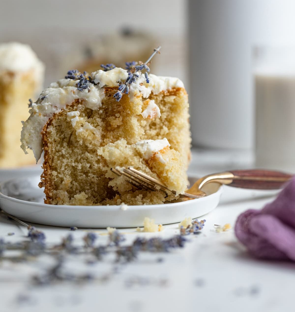 Slice of Chamomile Lavender and Honey Sheet Cake on a small plate
