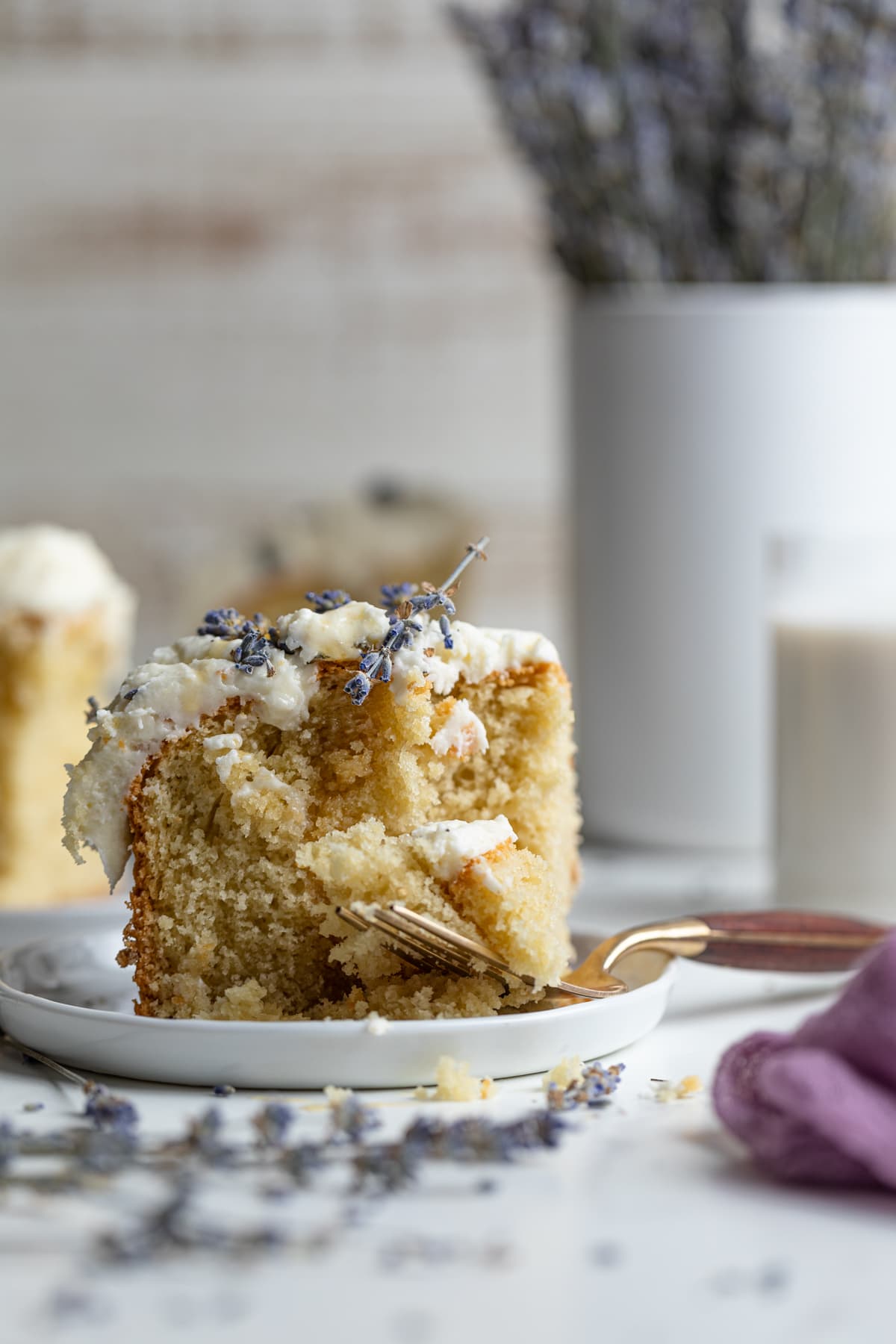 Slice of Chamomile Lavender and Honey Sheet Cake on a small plate