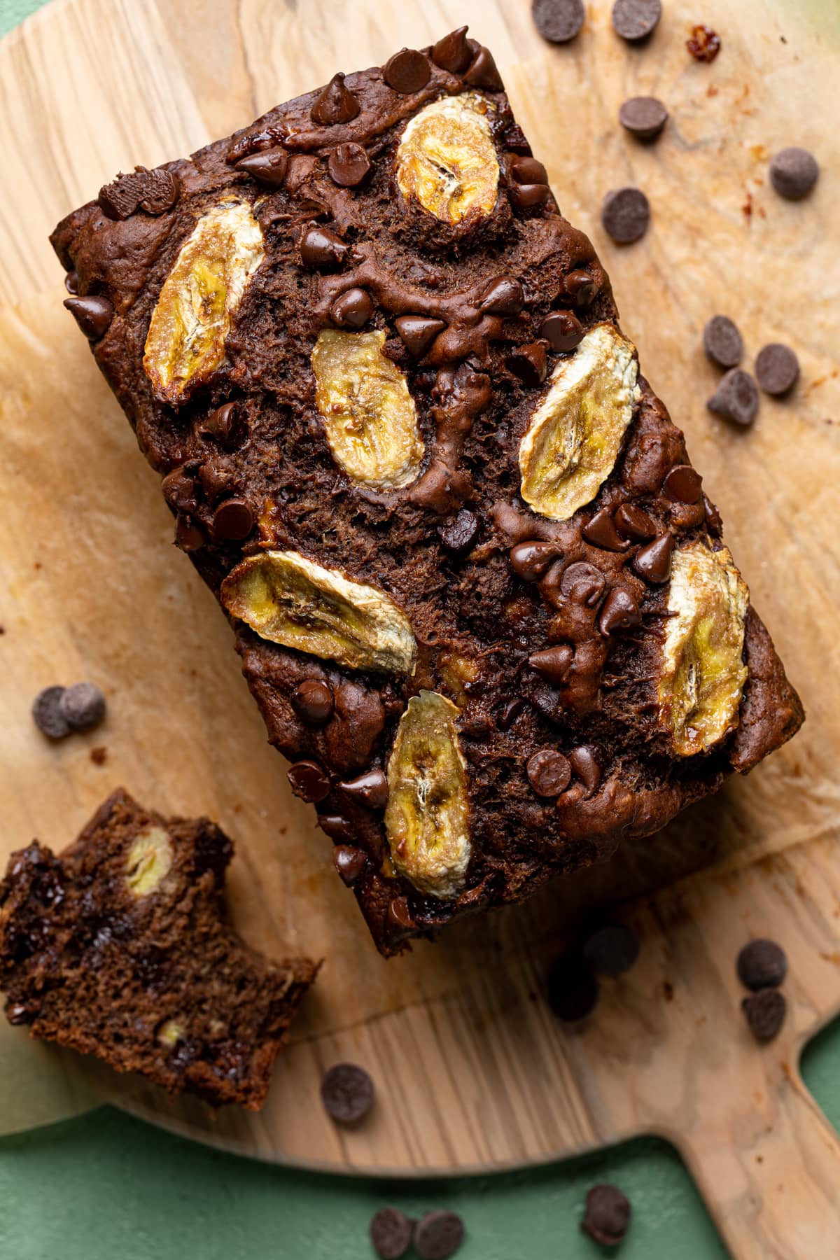 Partially-sliced loaf of Vegan Chocolate Bourbon Banana Bread.