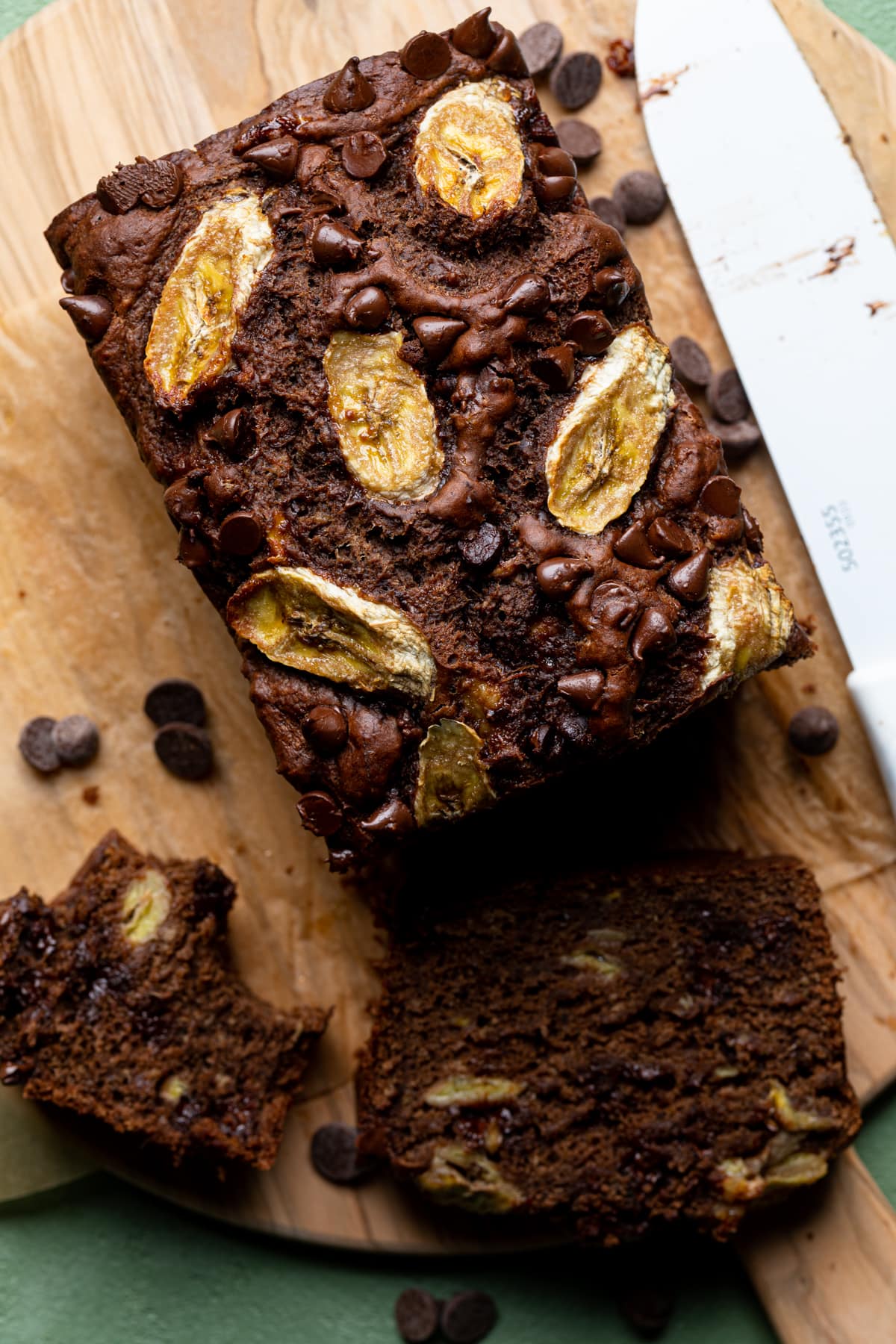 Loaf and slices of Vegan Chocolate Bourbon Banana Bread.