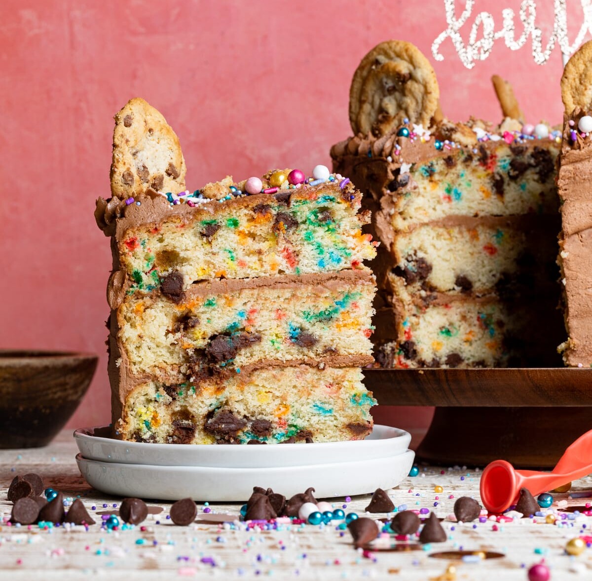 Slice being removed from a Confetti Chocolate Chip Cake.