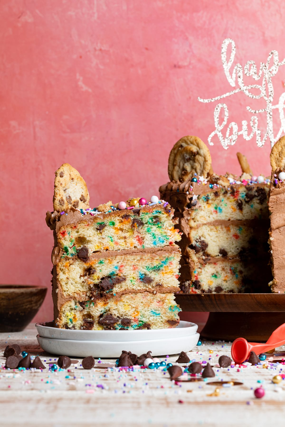 Slice being removed from a Confetti Chocolate Chip Cake.