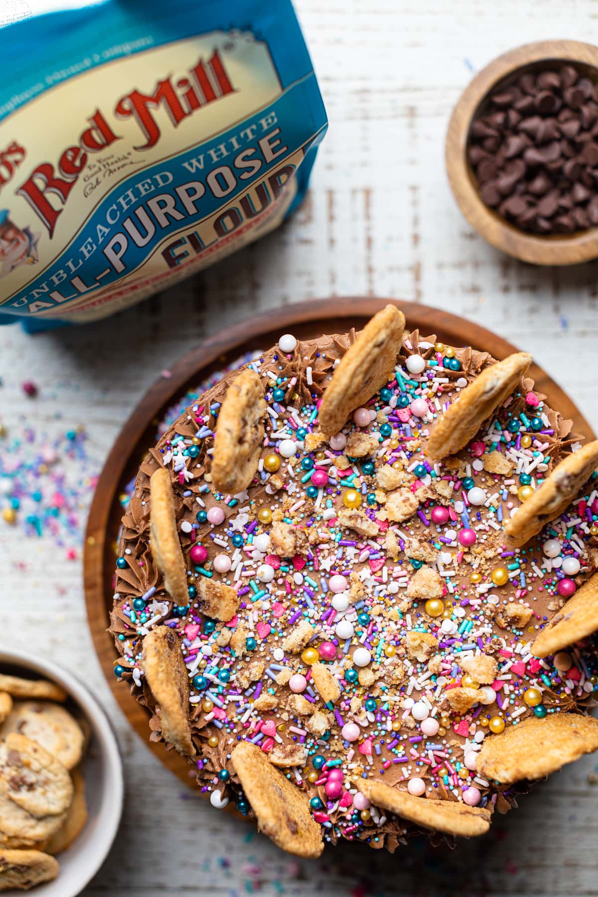 Confetti Chocolate Chip Cake decorated with sprinkles and cookies.