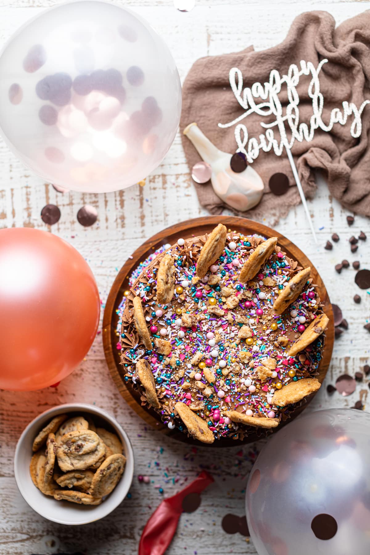 Confetti Chocolate Chip Cake surrounded with birthday decorations.