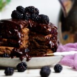 Stack of Vegan Chocolate Pancakes  topped with Blackberries.