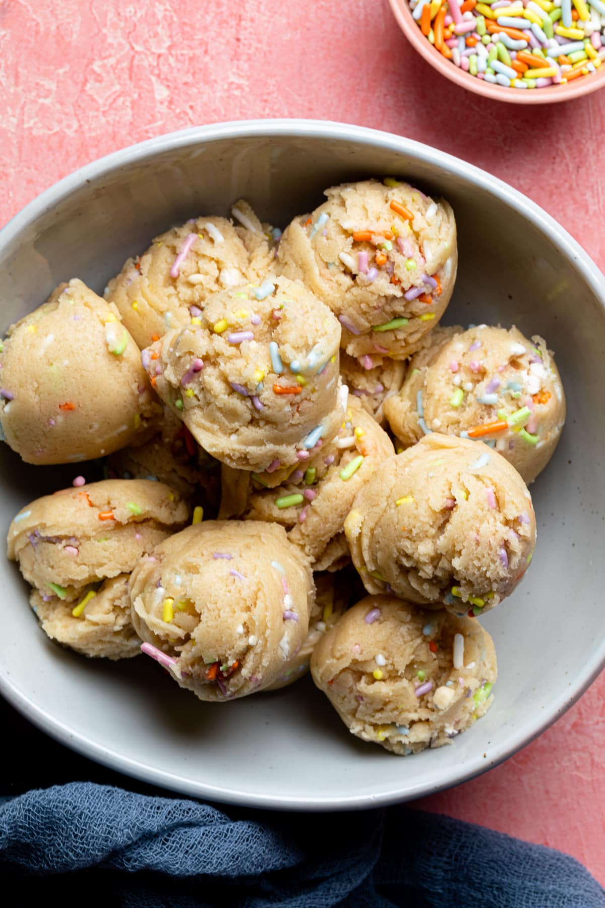 Scoops of Edible Vegan Funfetti Cookie Dough in a bowl.