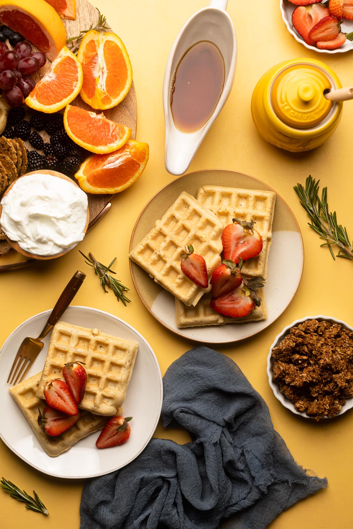 Plates of Gluten-Free Lemon Poppyseed Waffles.