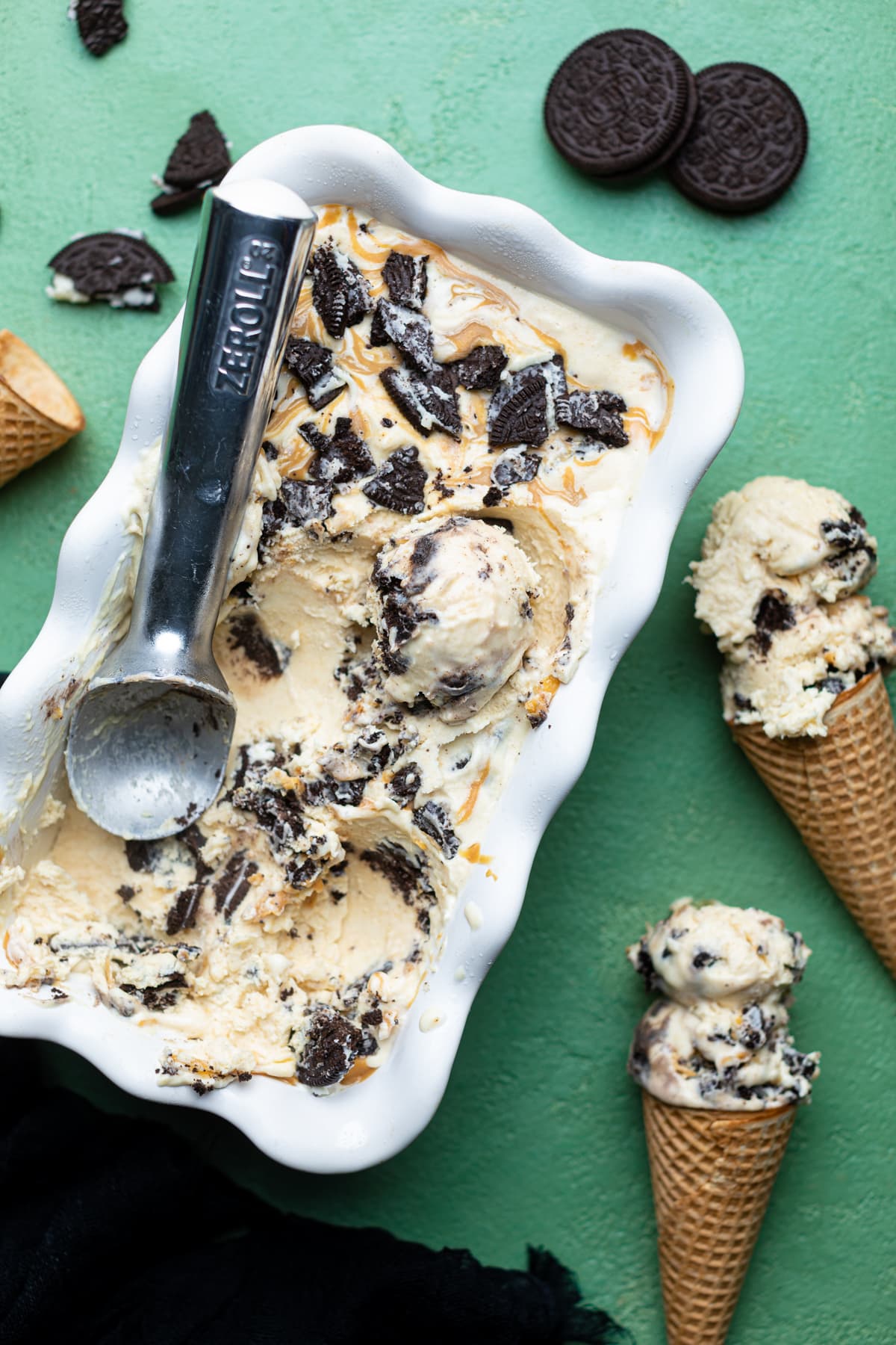 No-Churn Peanut Butter Oreo Ice Cream in a container and a cone.