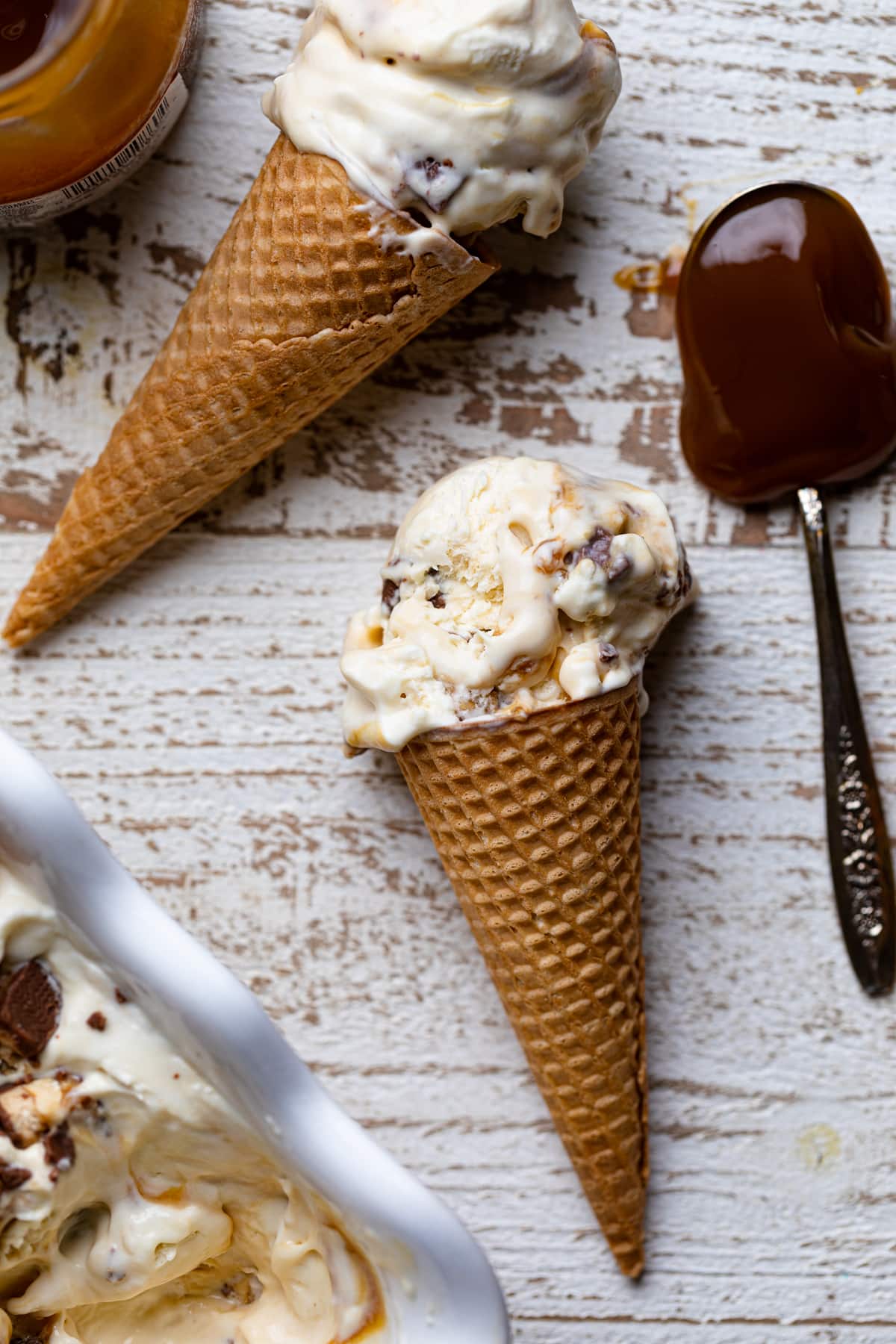 Loaded No-Churn Snickers Ice Cream in a cone.