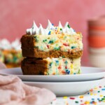 Funfetti Cheesecake Bar on two stacked plates.