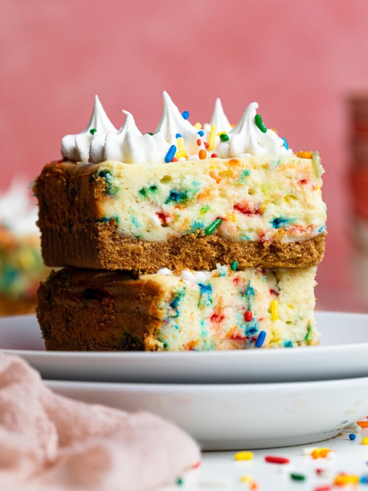 Funfetti Cheesecake Bar on two stacked plates.