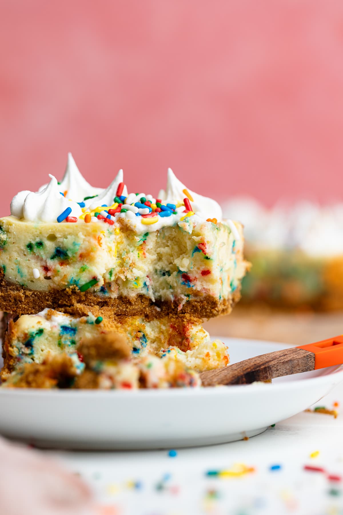 Fork with a piece of Funfetti Cheesecake Bar.