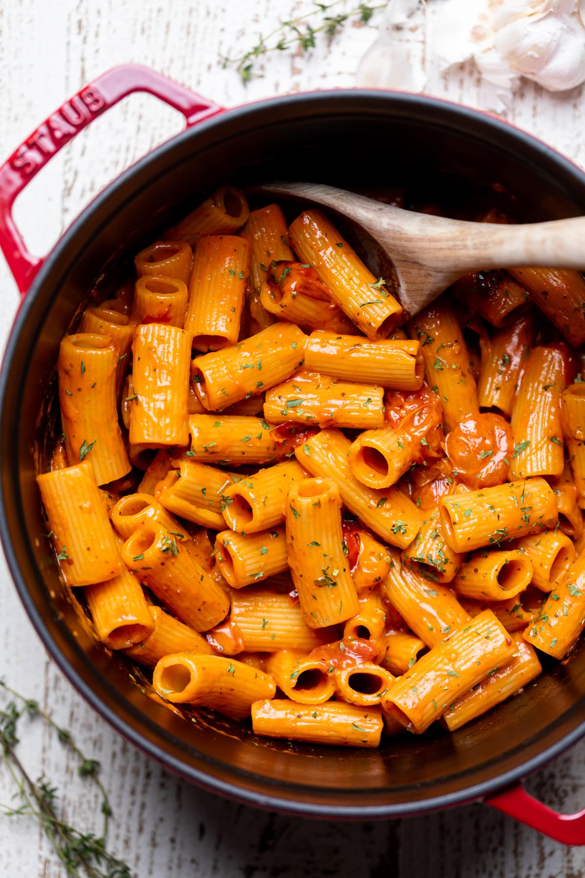 Wooden spoon stirring Spicy Cajun Vodka Pasta without Vodka.