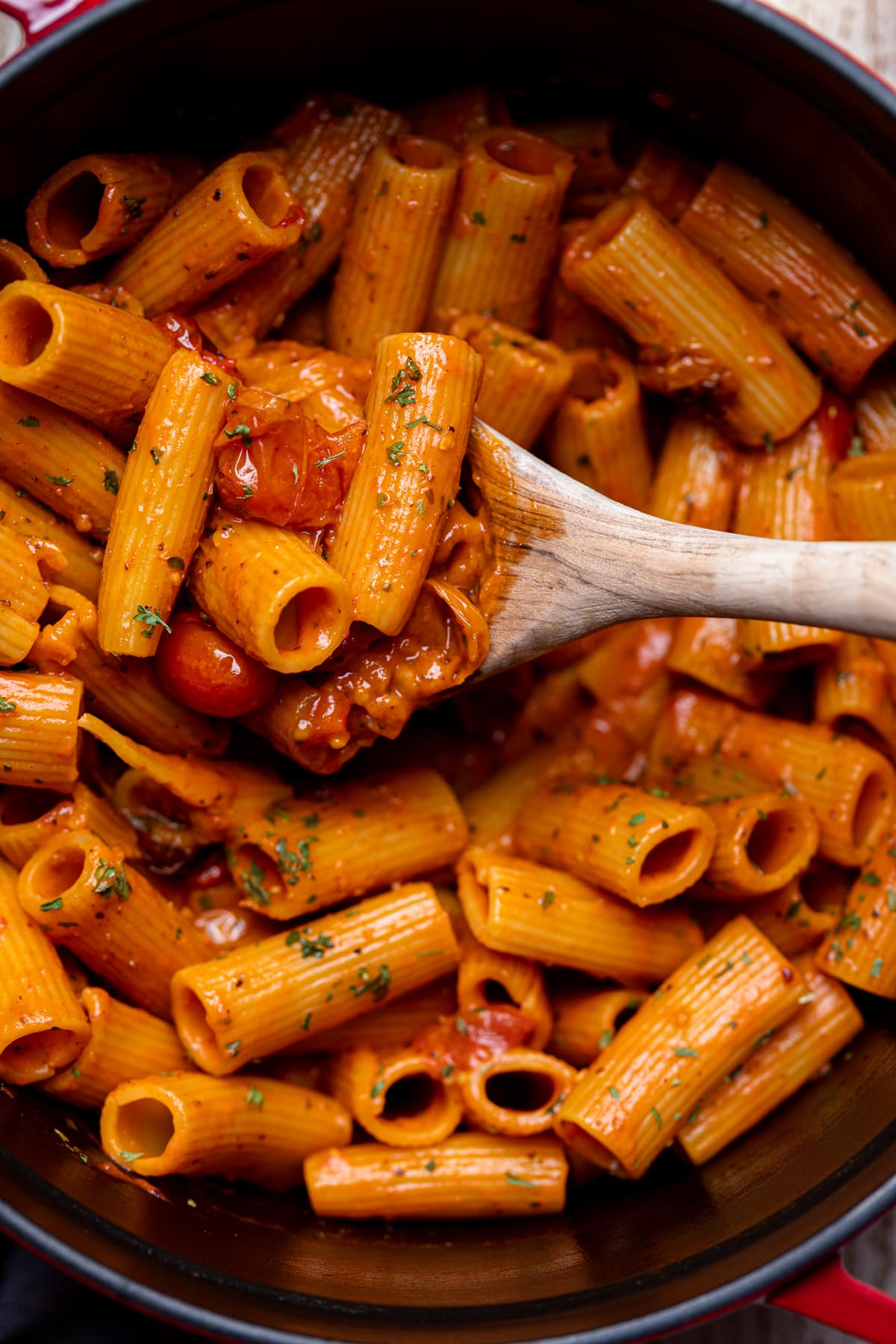 Wooden spoon scooping Spicy Cajun Vodka Pasta without Vodka.