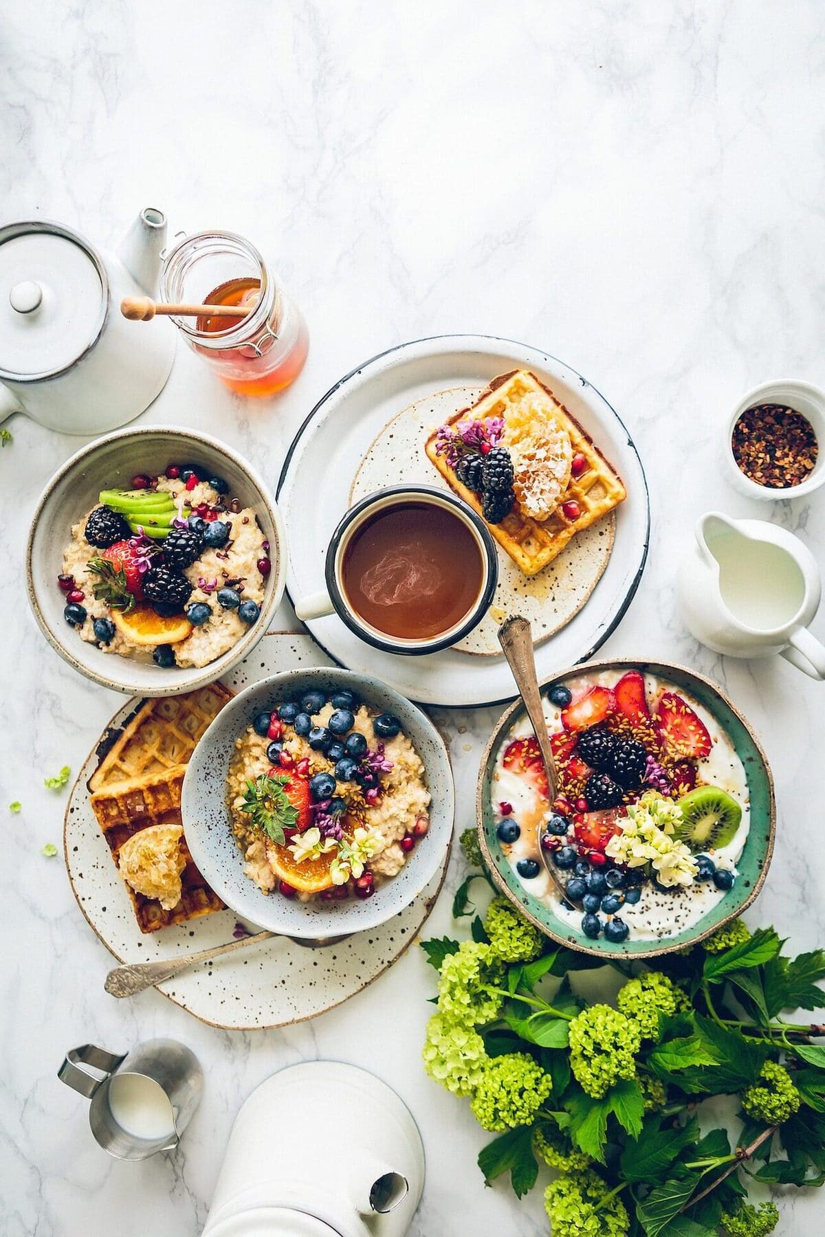 Colorful foods in bowls and on plates.