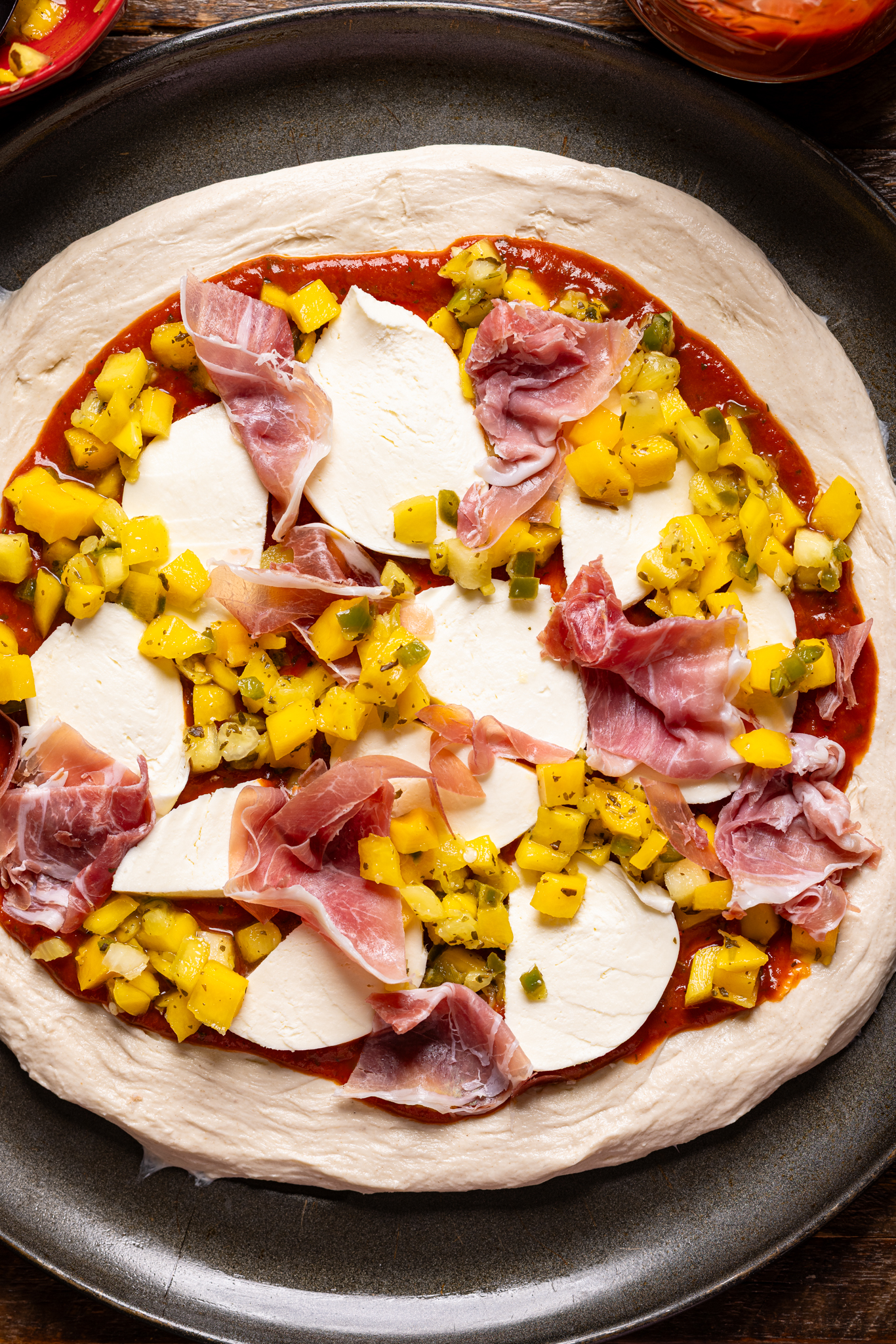 Image of ingredinets on a pizza crust.
