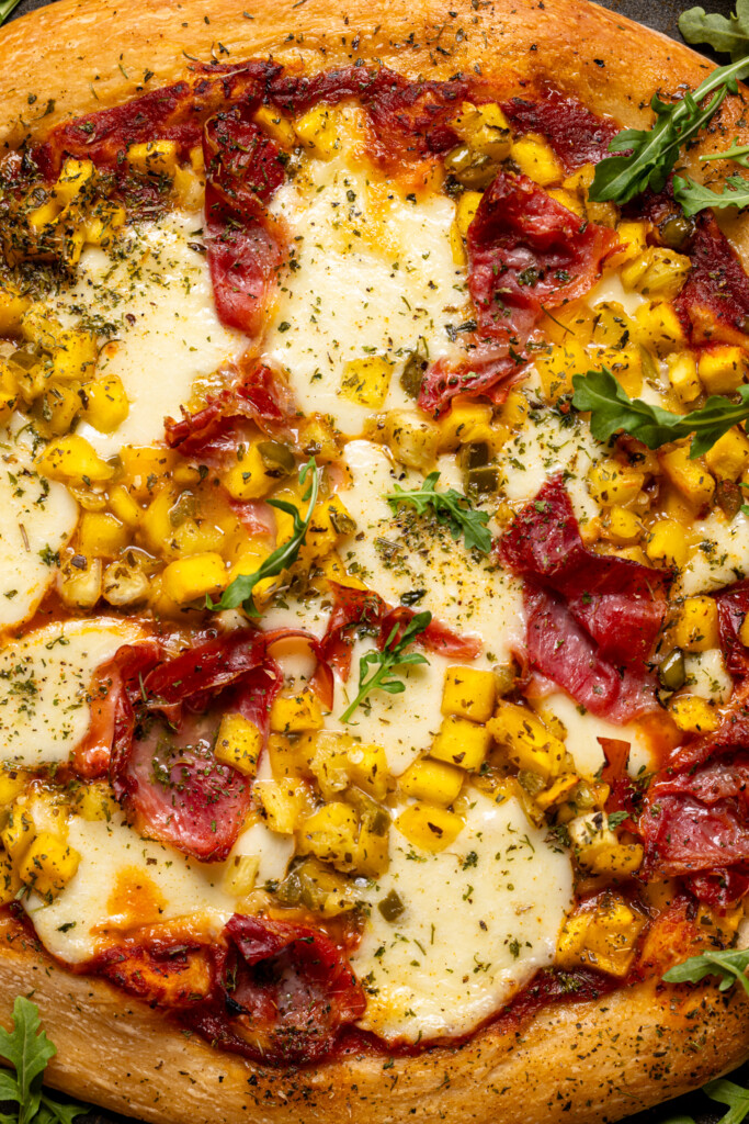 Image of baked Hawaiian pizza with toppings.