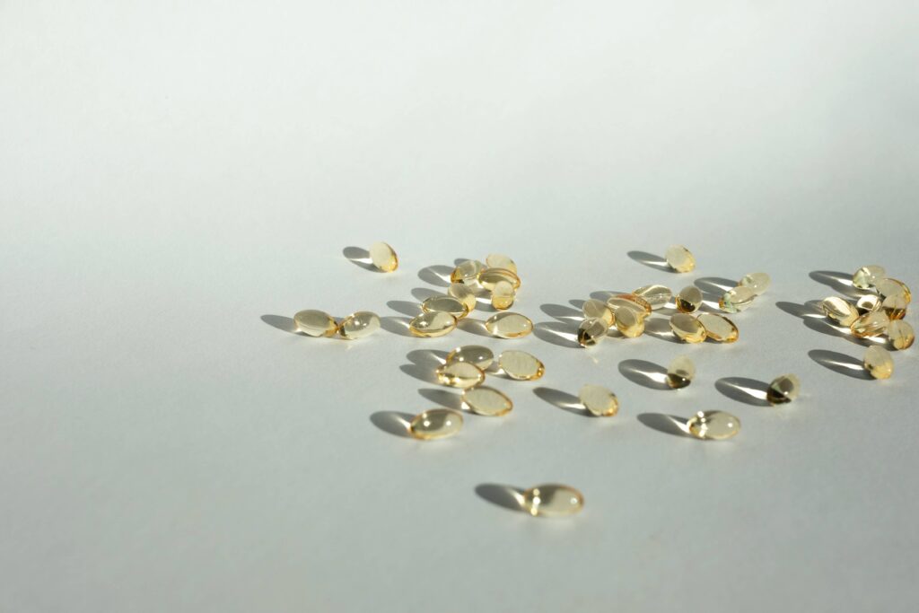 Clear pill supplements on a white surface