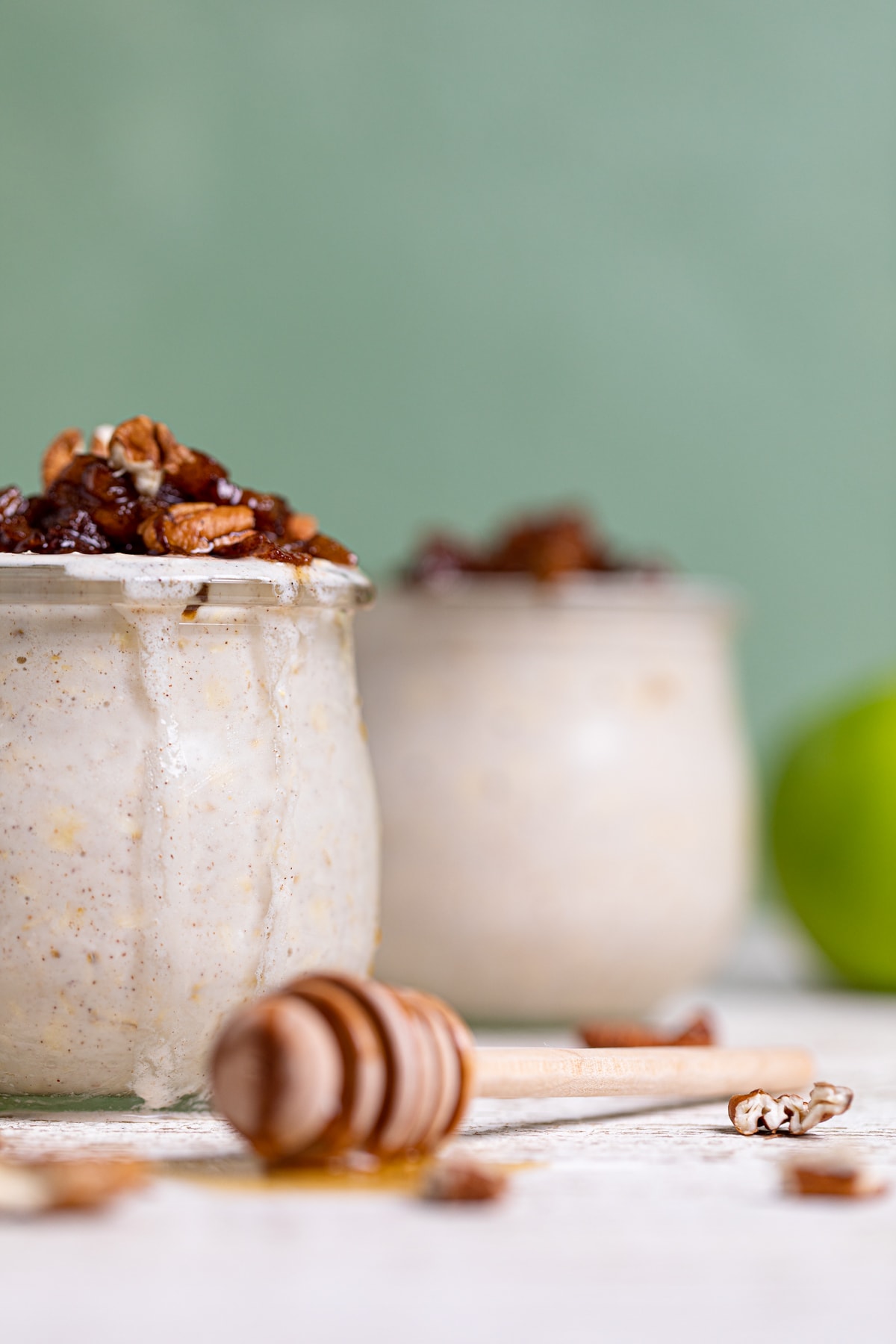 Glasses of Apple Pie Overnight Oats on a table.