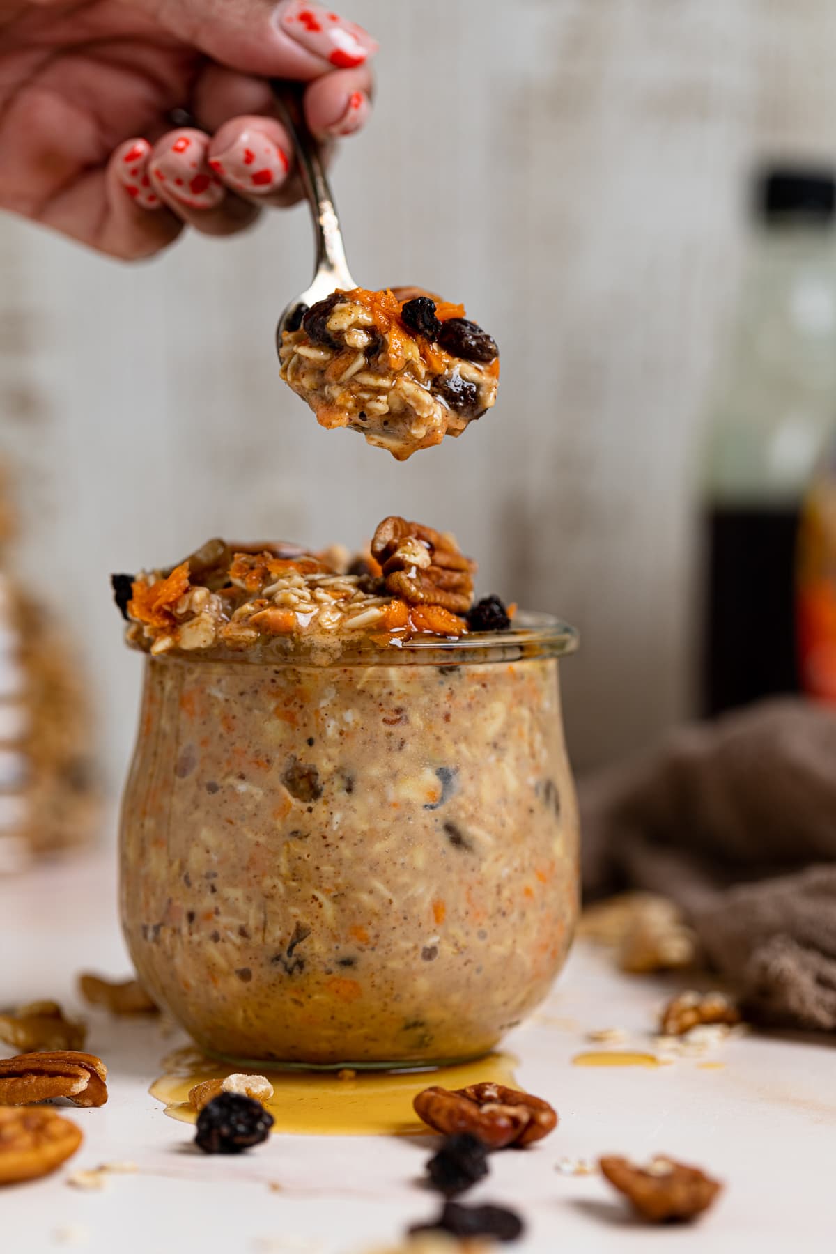 Spoon with a scoop of Spiced Carrot Cake Overnight Oats