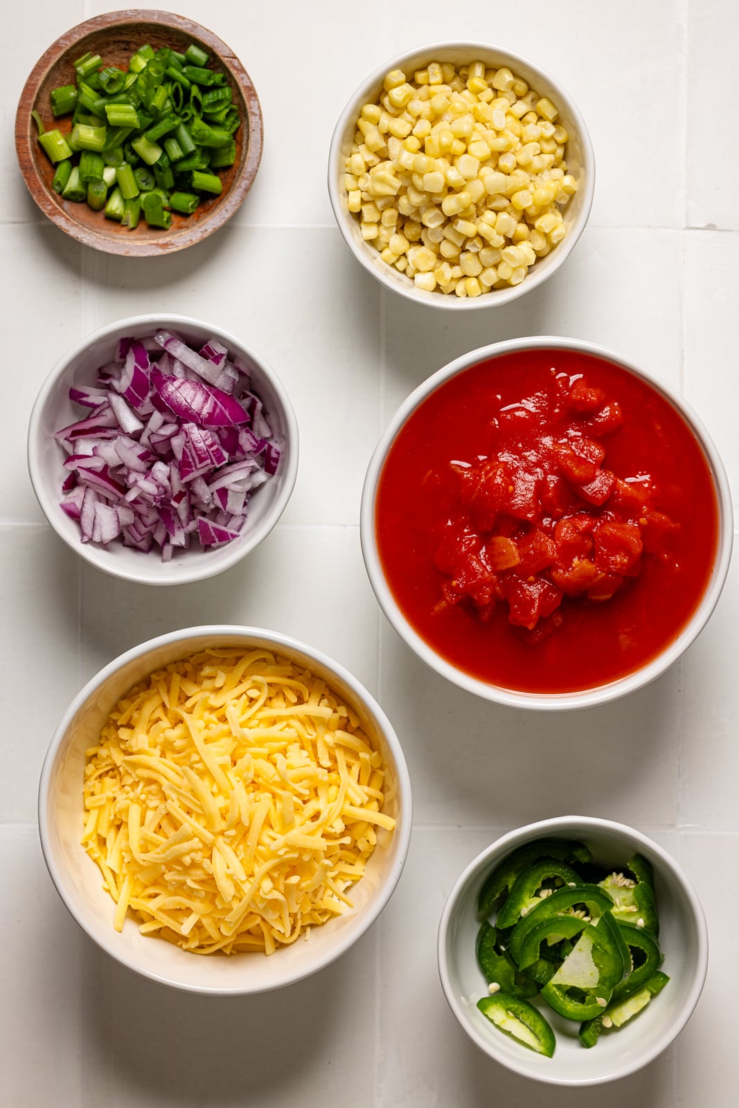 Ingredients on a white tile table.