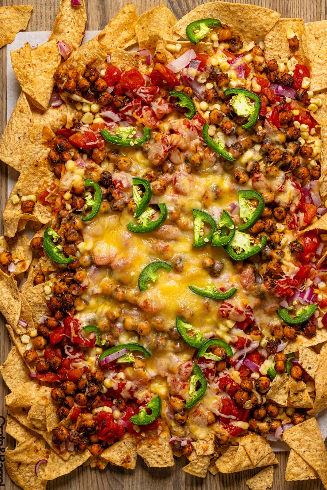 Baked nachos on a baking sheet.