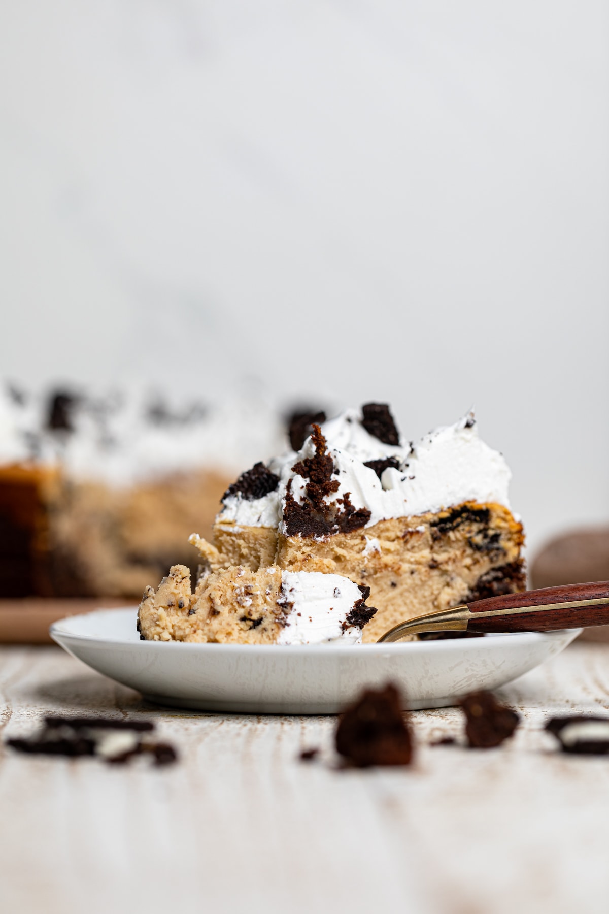 Slice of Gluten-Free Peanut Butter Cookies N\' Cream Brownie Cheesecake