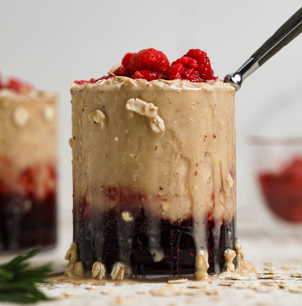 Glass of Protein Peanut Butter and Jelly Overnight Oats